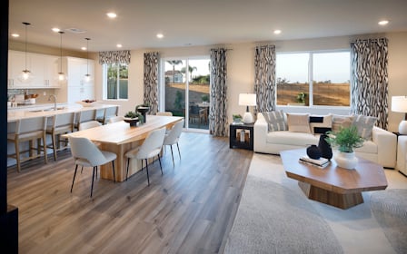 A large living room with a large window.