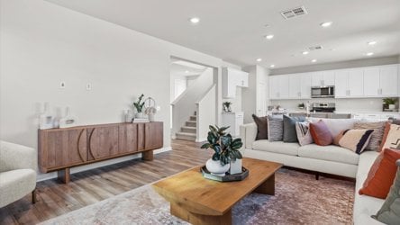 A living room with a couch and a table.