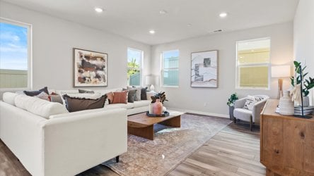 A living room with a white couch.