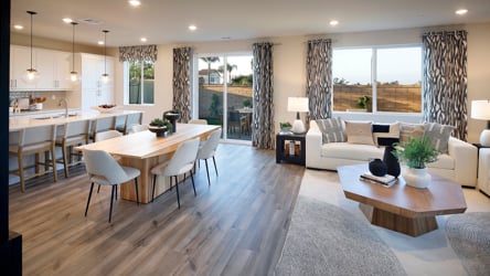 A large living room with a large window.