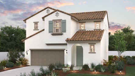 A white house with a garage.