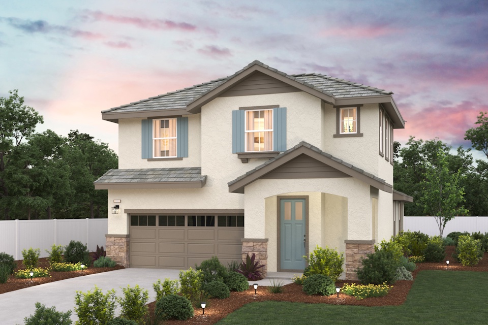 A house with a garage and bushes.
