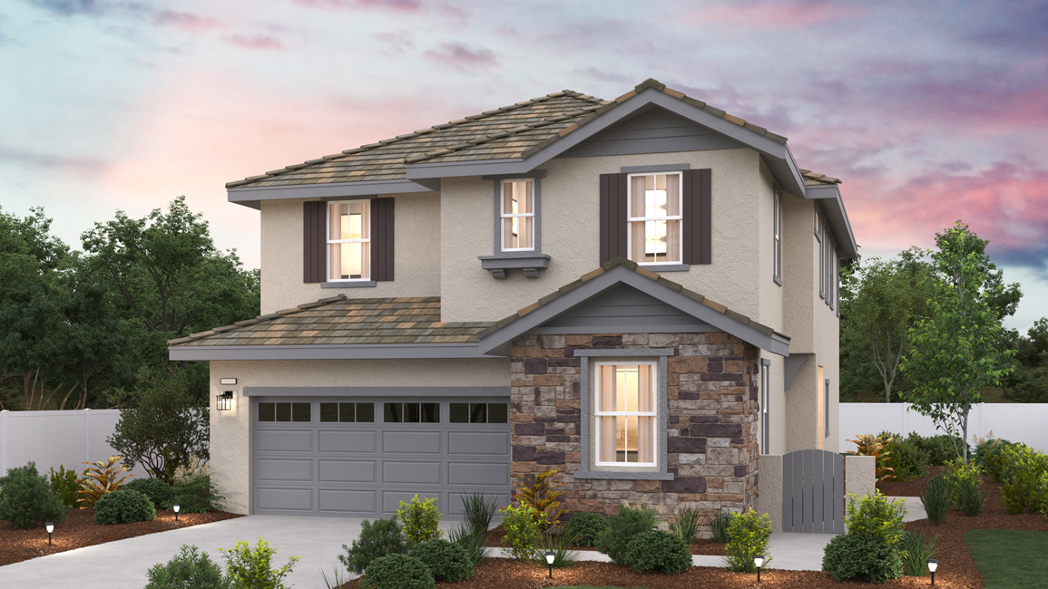A house with a garage and trees.