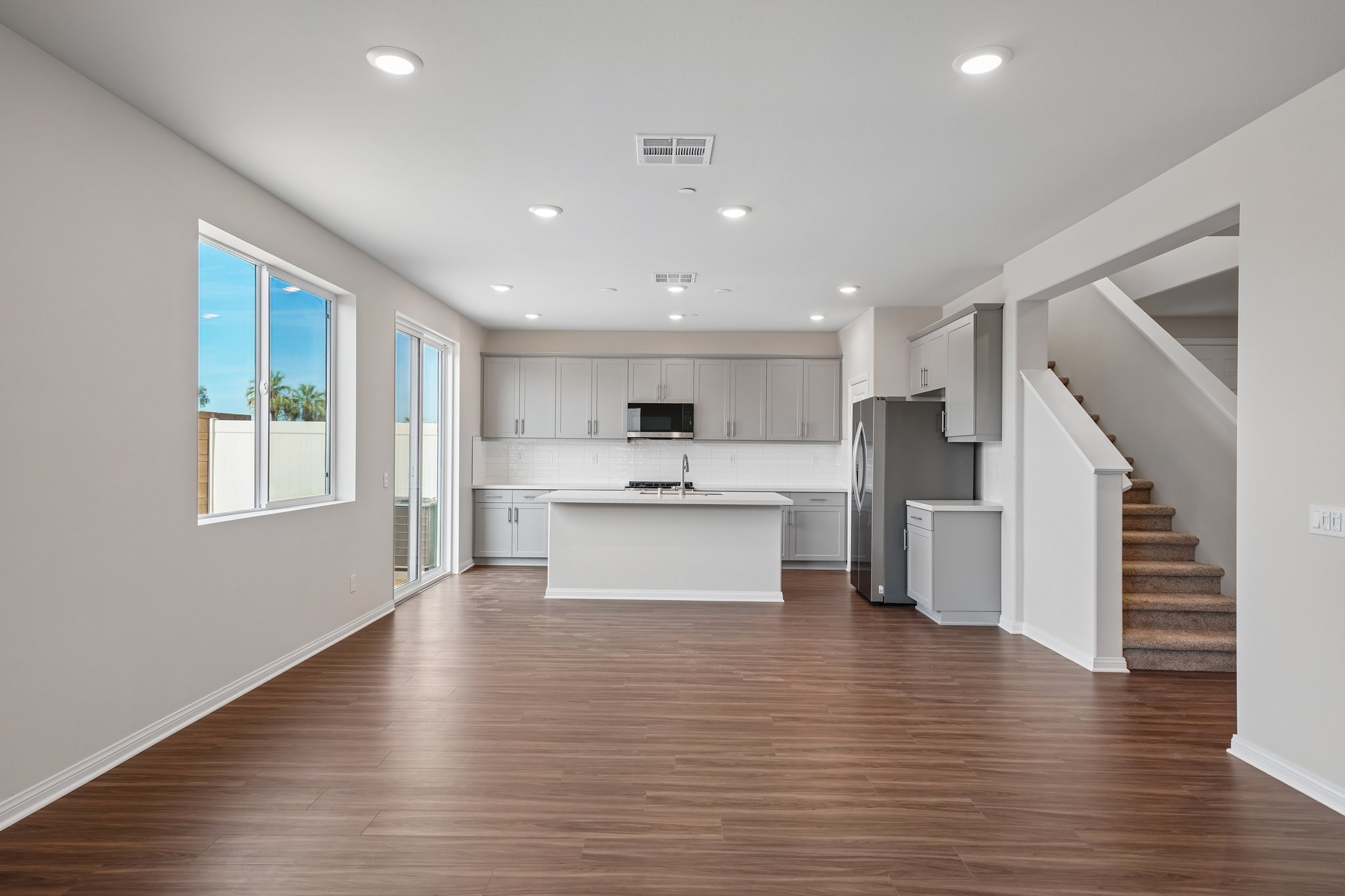 A large kitchen with white cabinets.