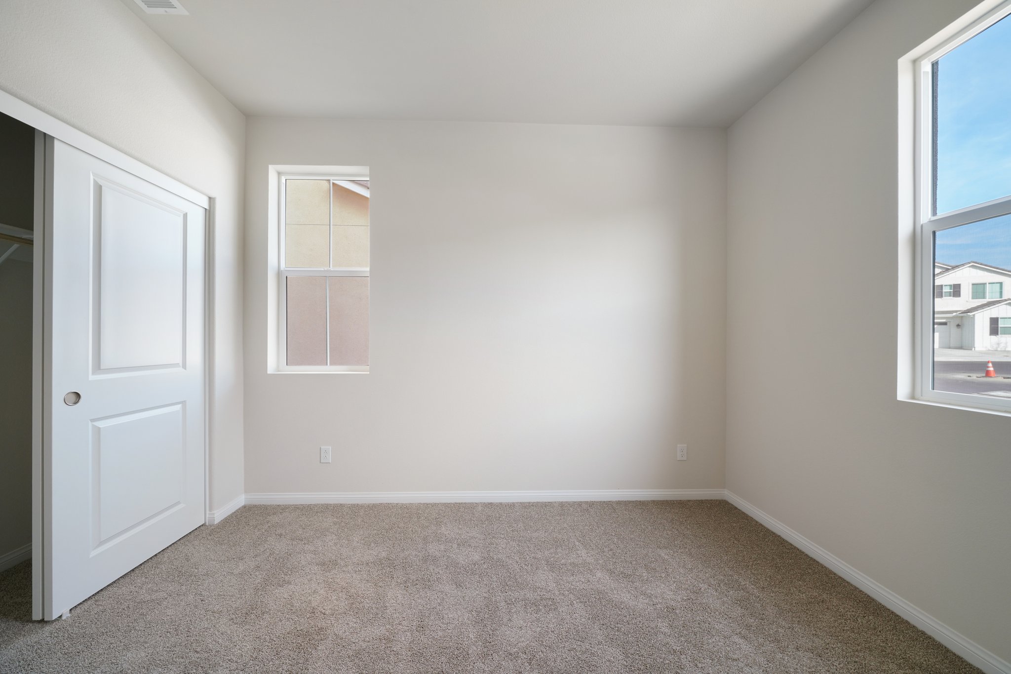 A room with a door and windows.