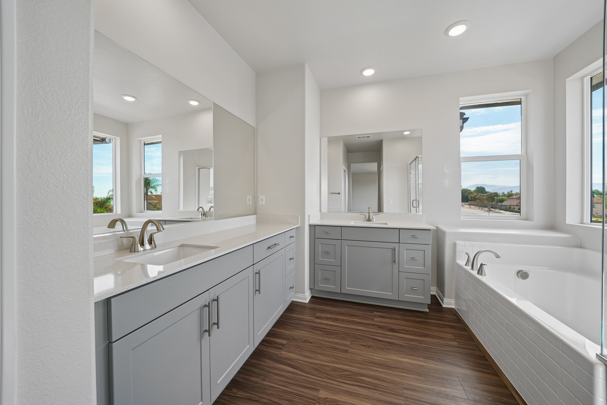 A bathroom with a tub sink and a bathtub.