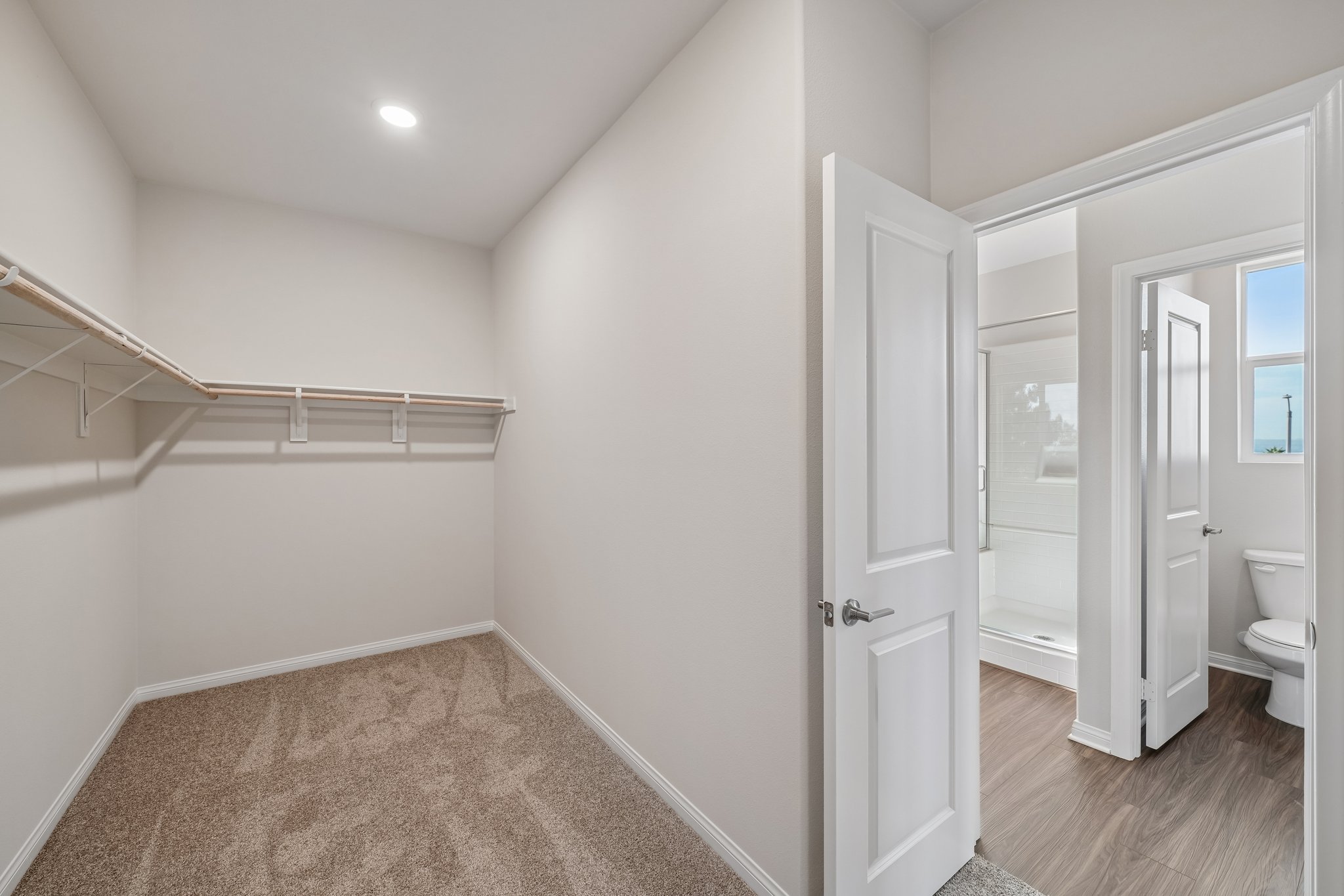 A bathroom with a shower unit.