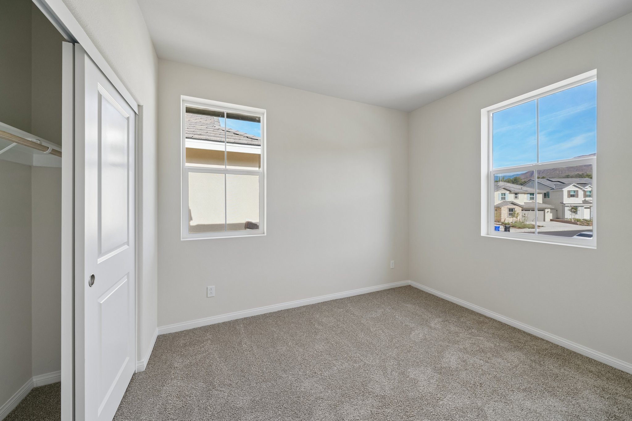 A room with a window and a door.