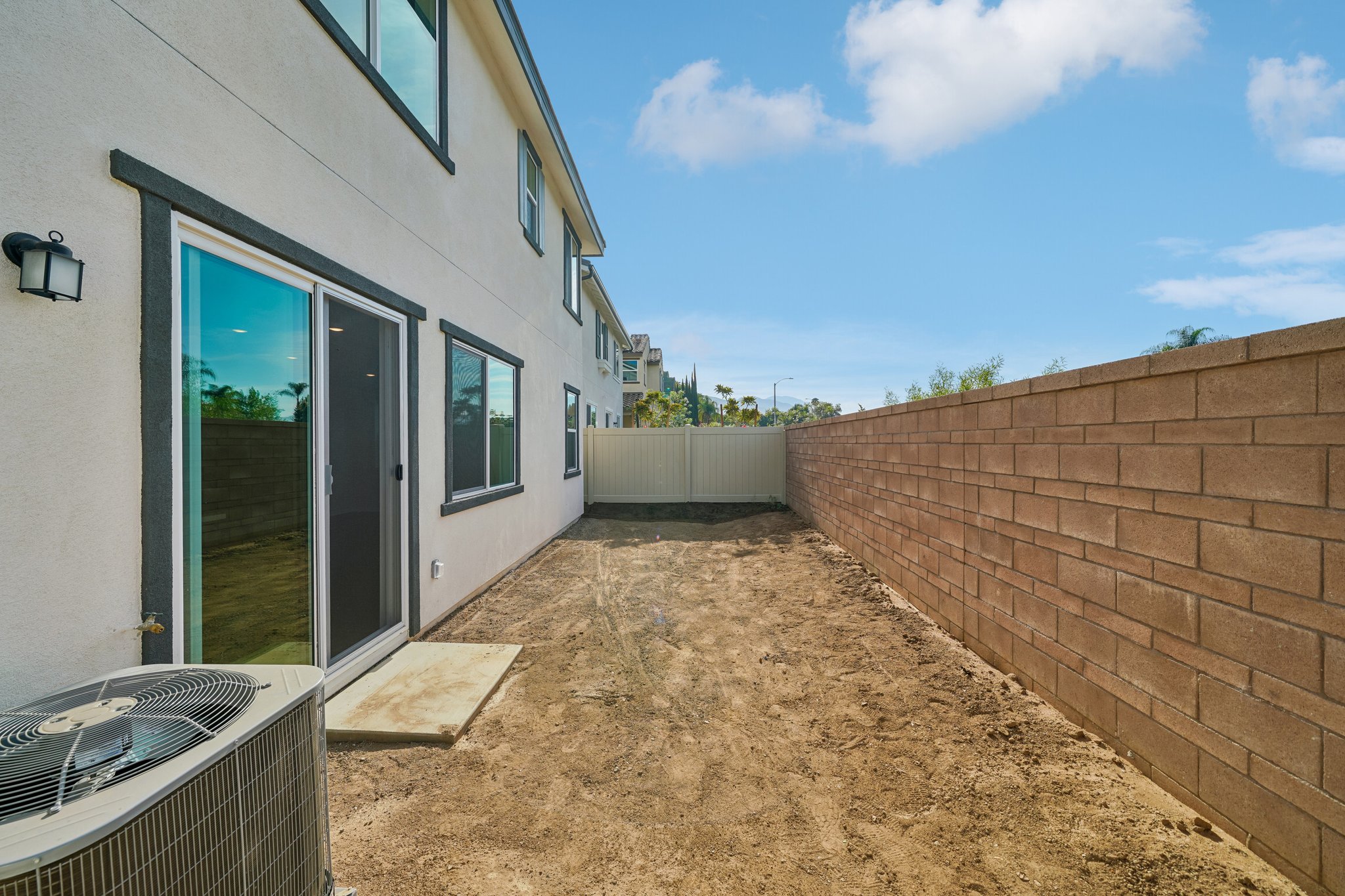 A dirt path between buildings.