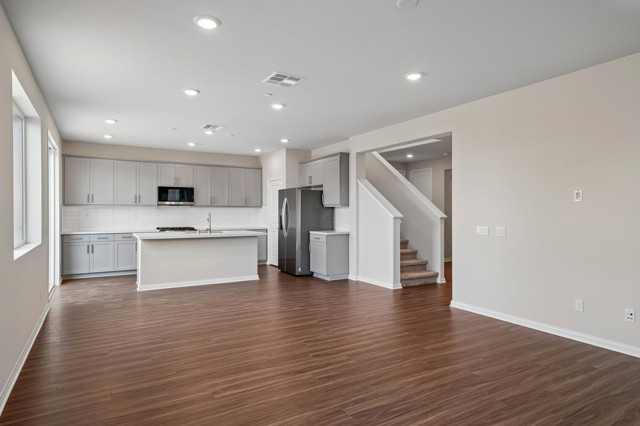 A large kitchen with white cabinets.