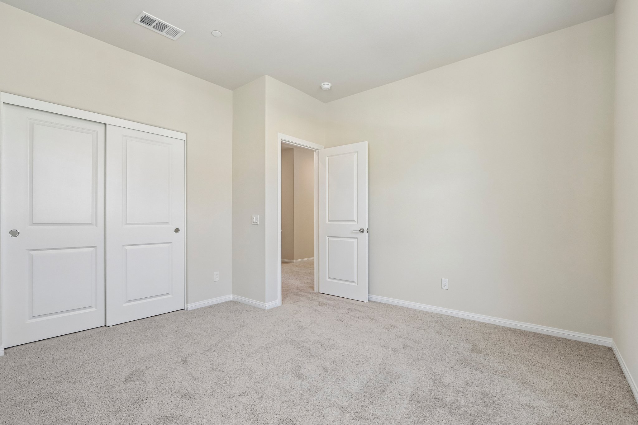 A room with white doors.