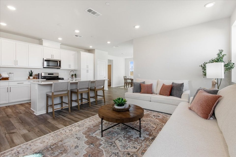 A large living room with a large kitchen and dining area.