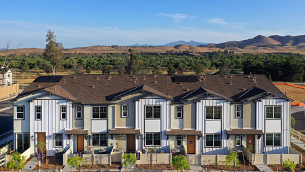 A large house with a fence around it.