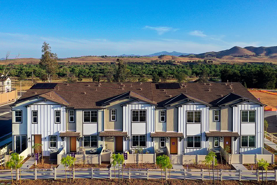 A large house with a fence around it.