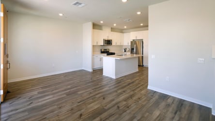 A kitchen with white walls.