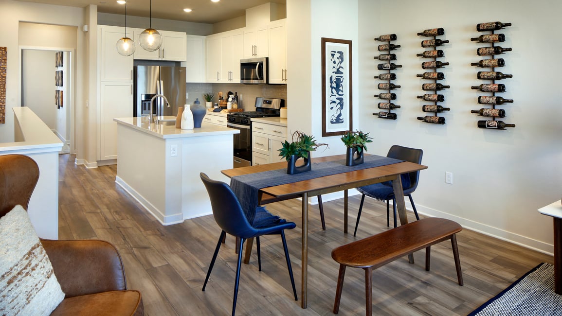 A kitchen with a dining table.