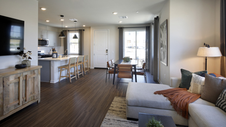 A living room with a wood floor.