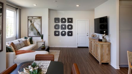A living room with a couch and a table.