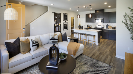 A living room with a couch and a table.
