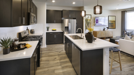 A kitchen with black appliances.