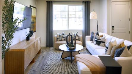 A living room with a couch and a coffee table.