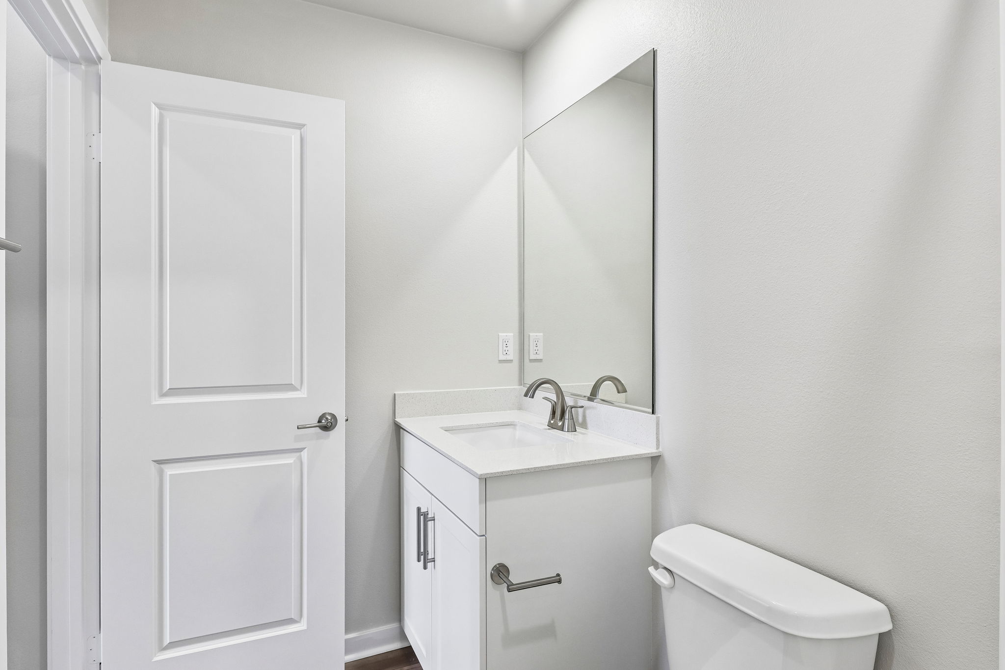 A bathroom with a sink and toilet.