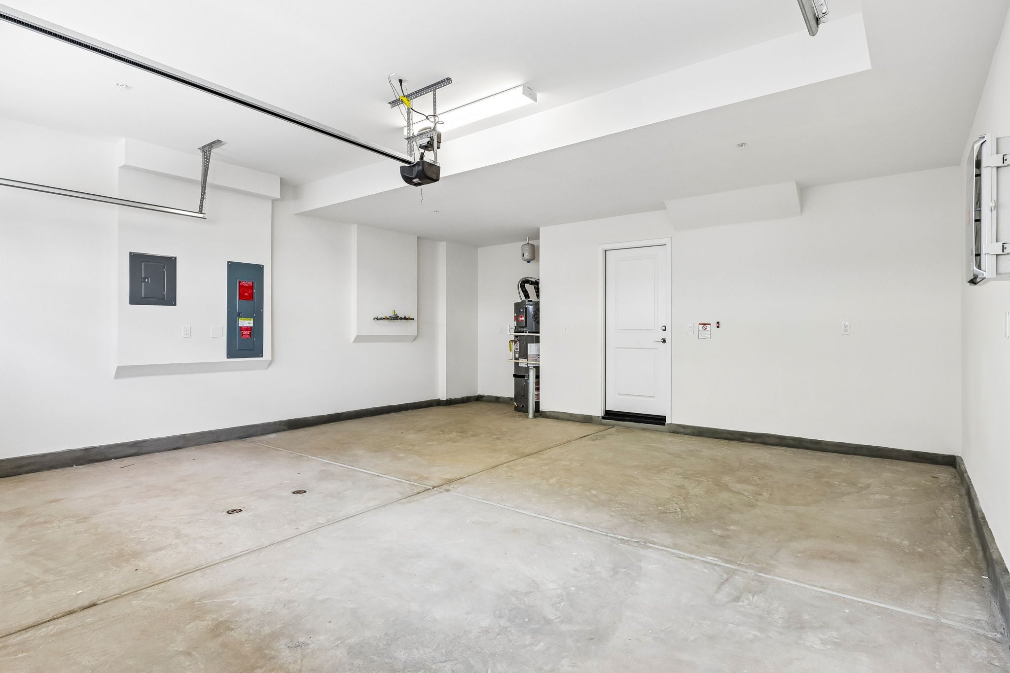 A room with white walls and a wood floor.