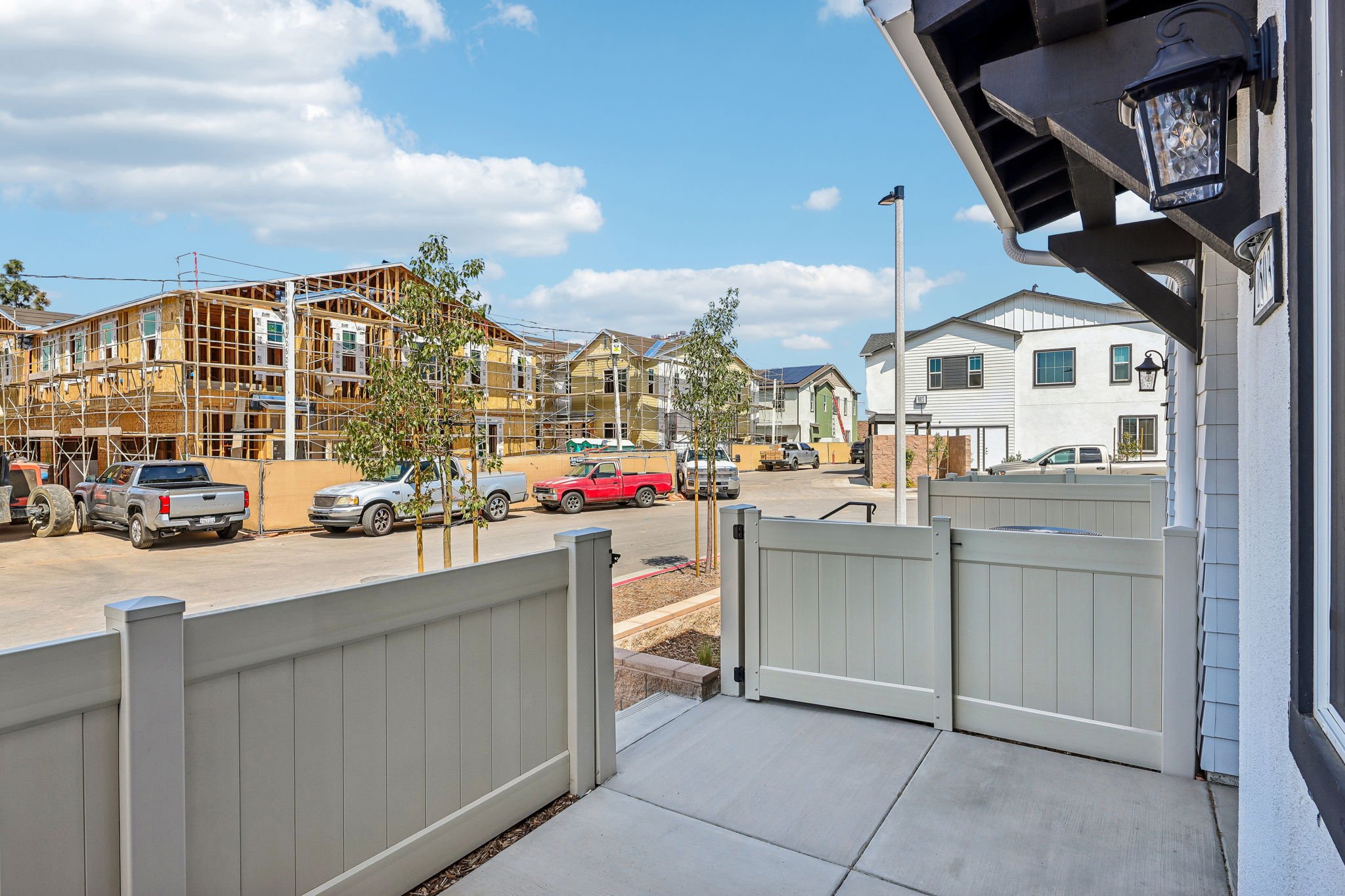 A street with cars parked on the side.