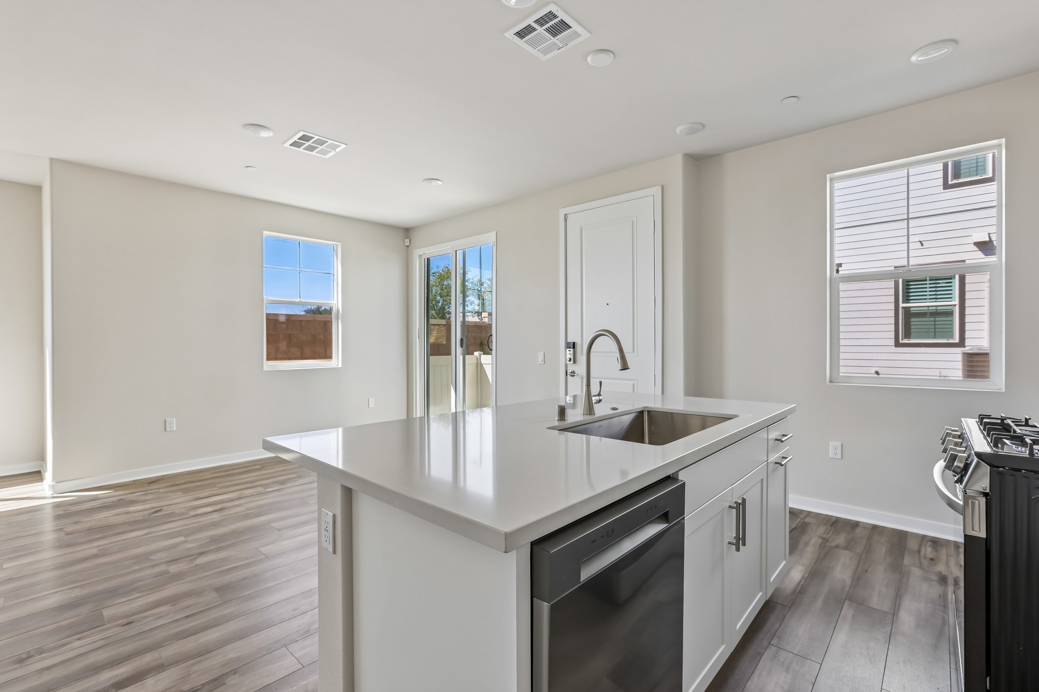 A kitchen with a sink and cabinets.