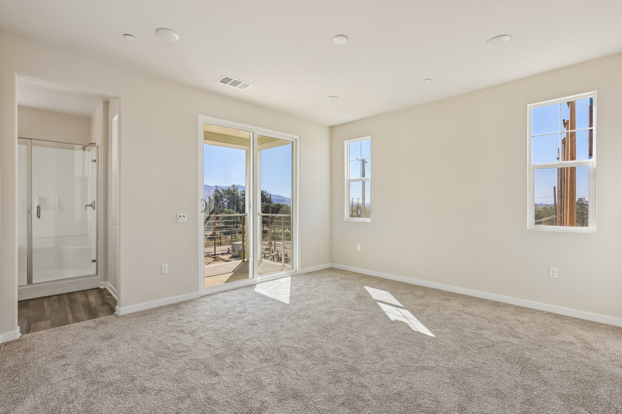 A room with a large glass door.