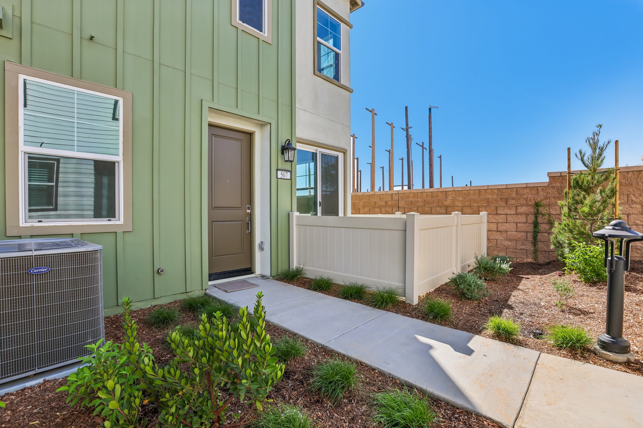 A house with a fence and a garage.