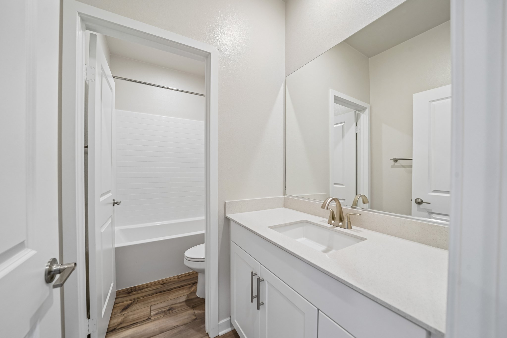A bathroom with a sink and a toilet.