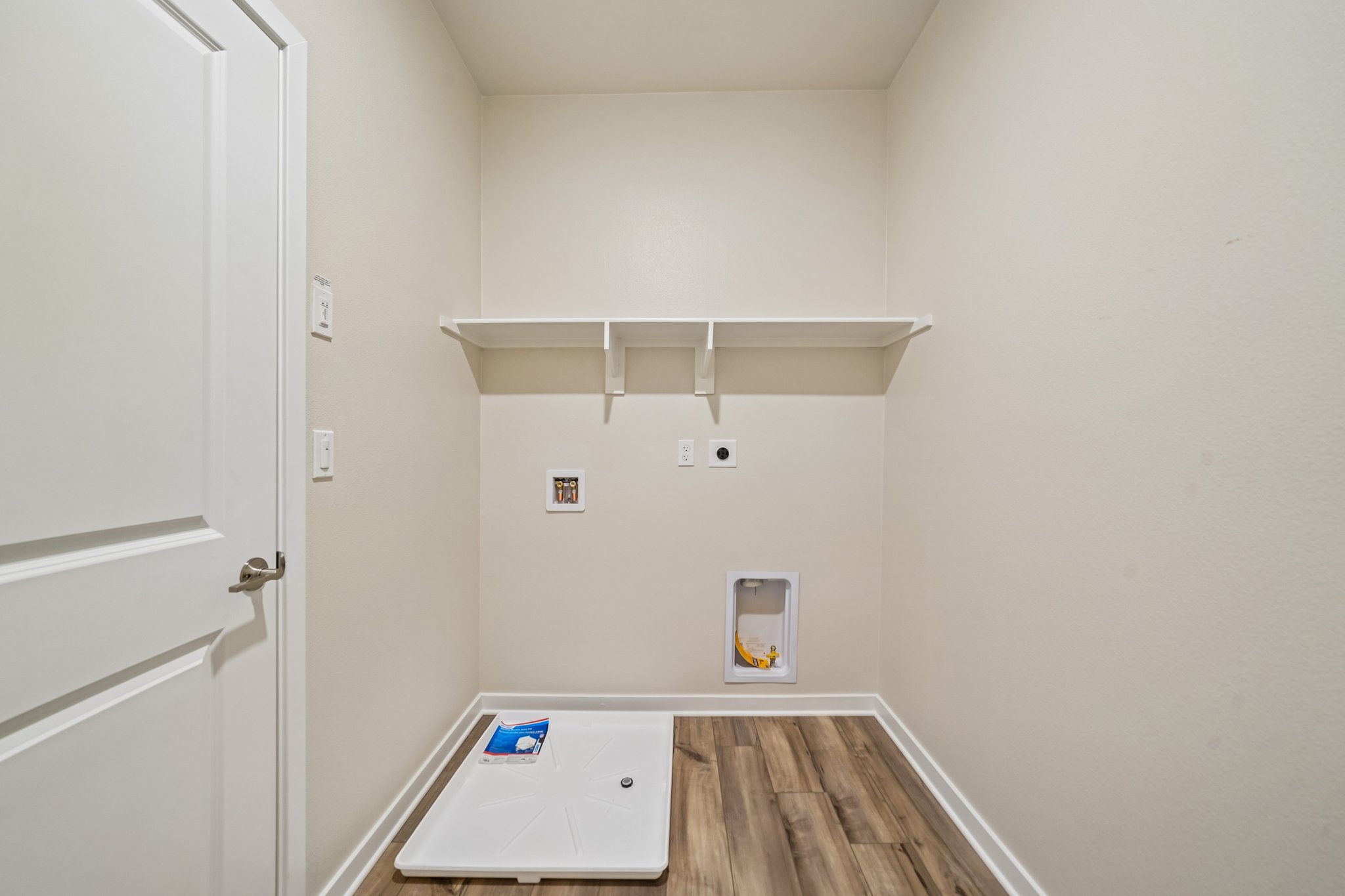 A room with a table and a door.
