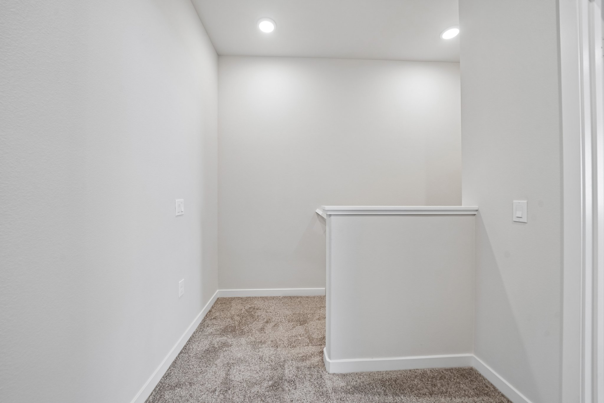 A white room with a white wall.