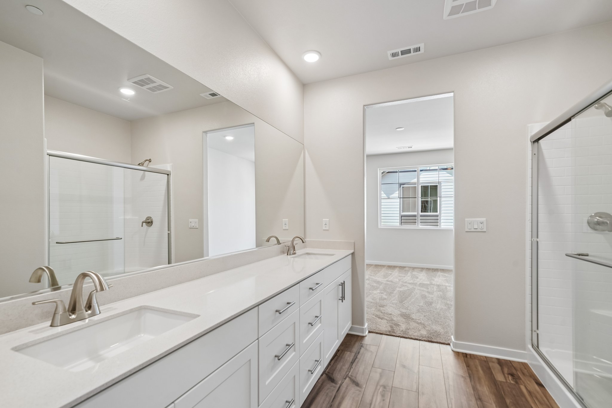 A bathroom with a glass shower.