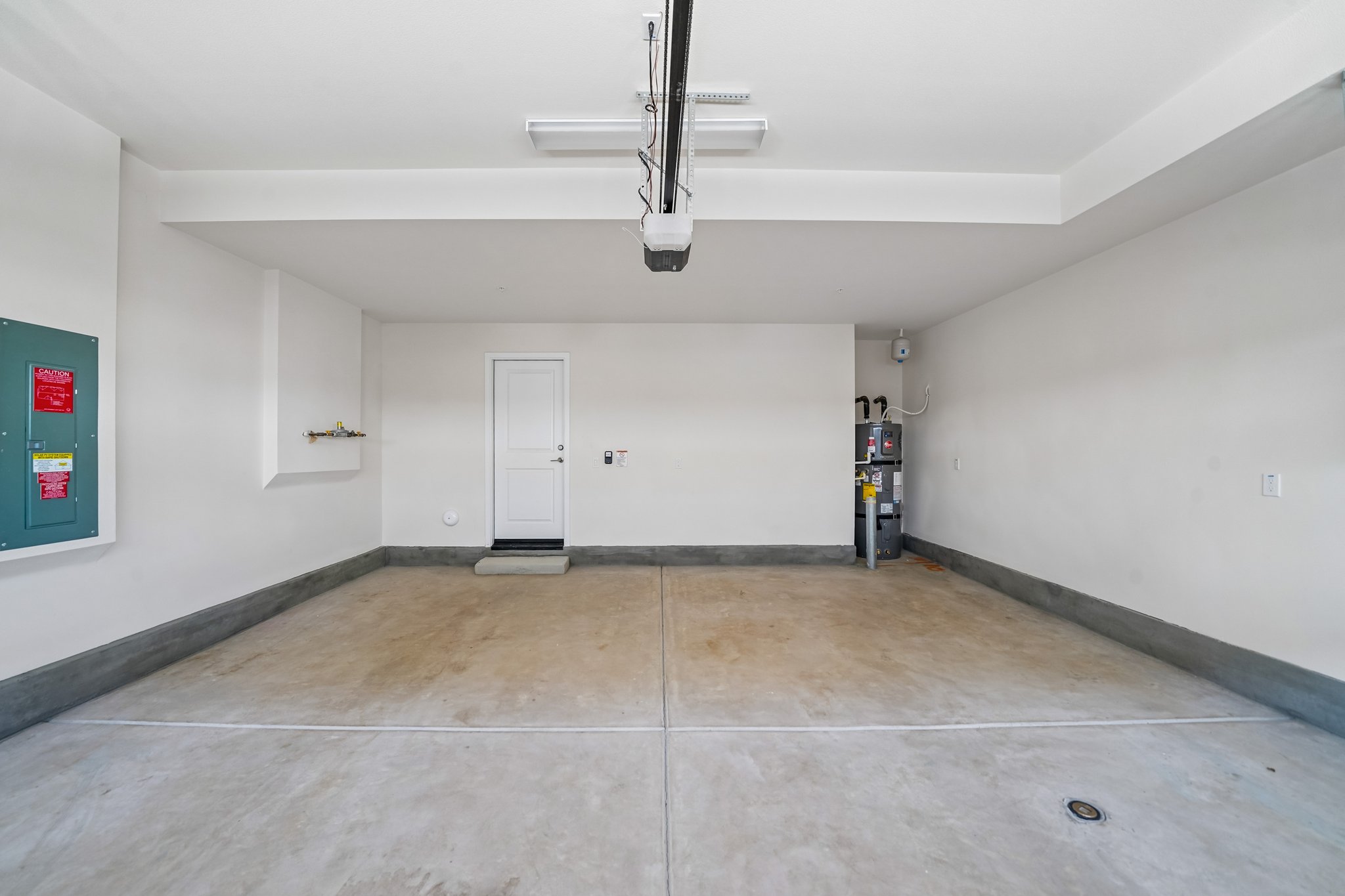 A room with a tile floor and a white door.