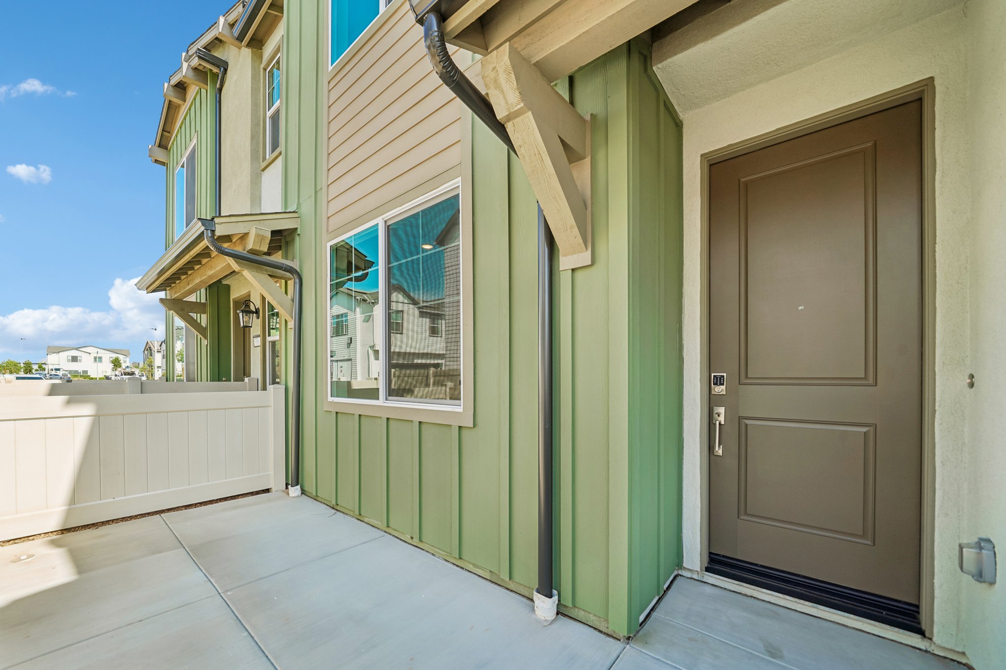 A green building with a door.