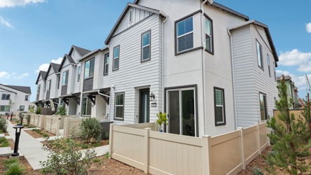 A white house with a fence.