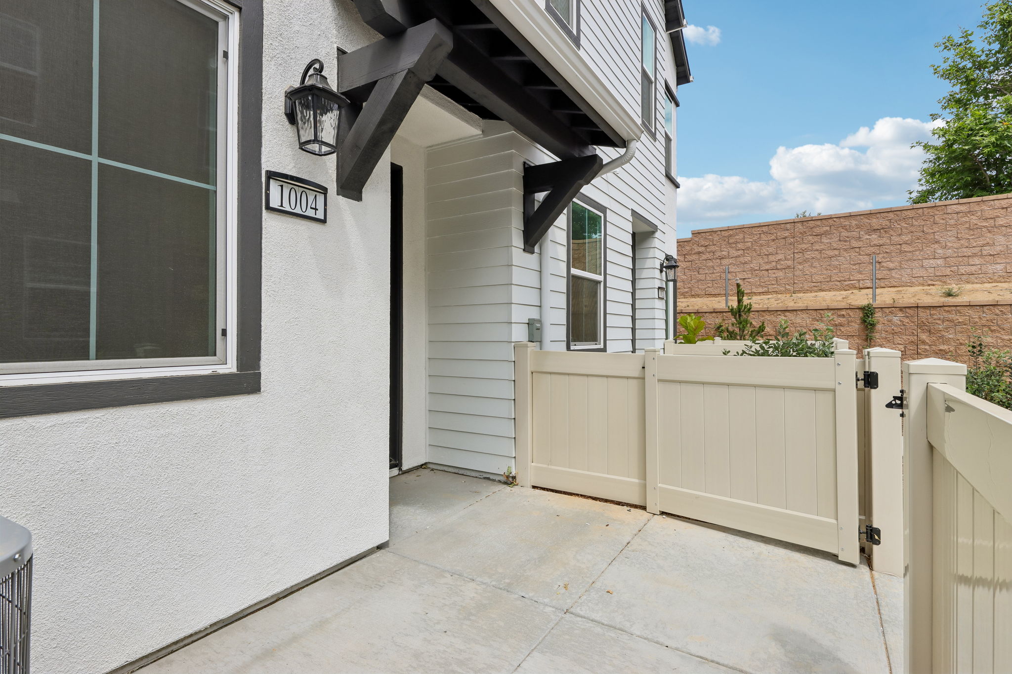 A white building with a fence.