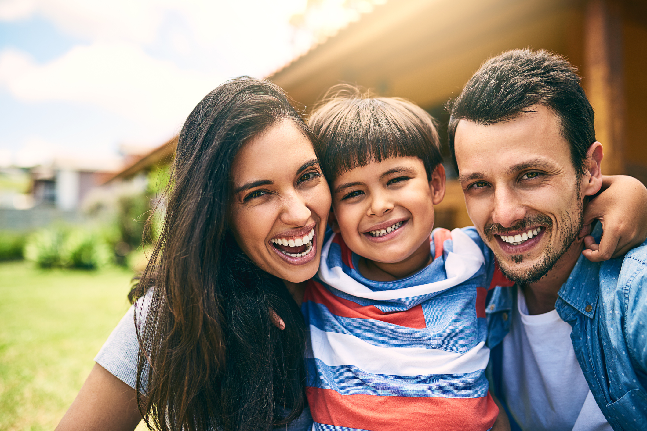 A family smiling for a picture.