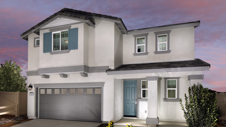 A white house with a garage.