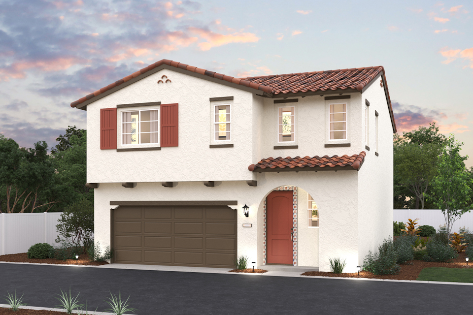 A white house with a garage.