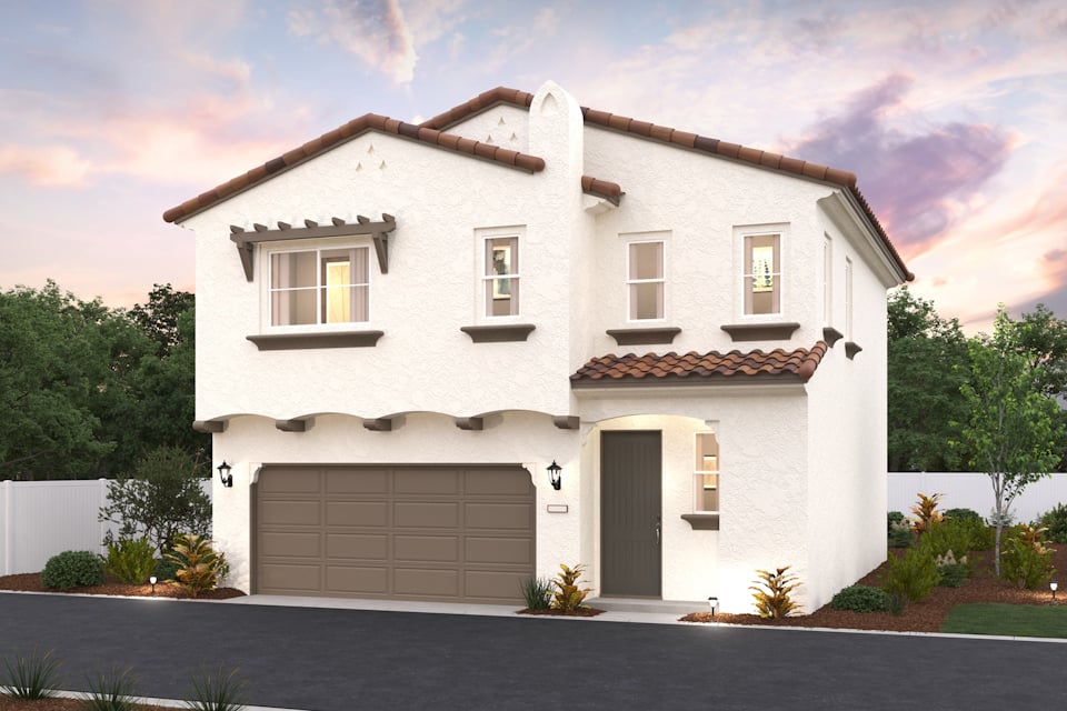 A white house with a garage.