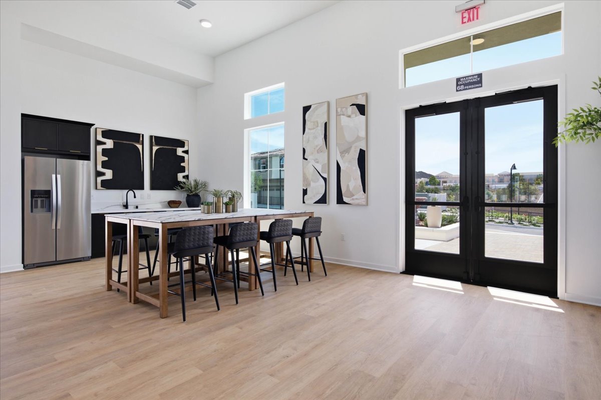 A room with a table and chairs.