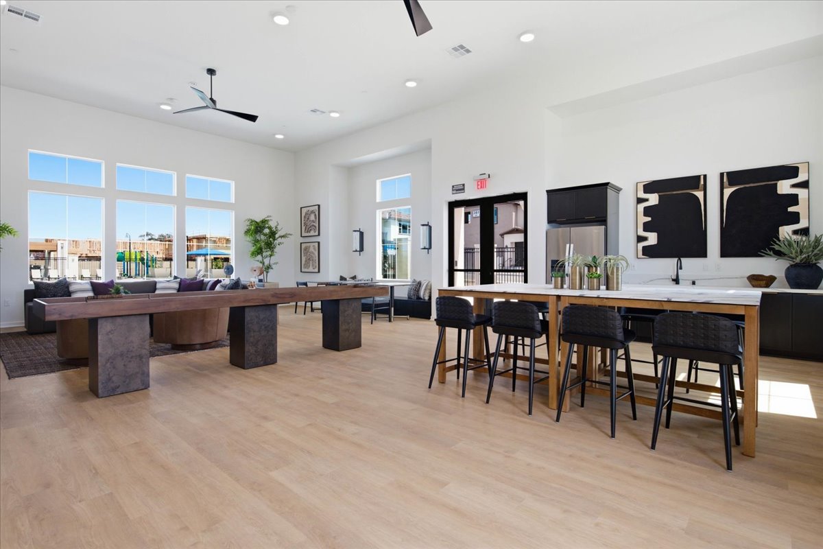 A room with a table and chairs.