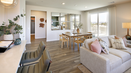 A living room with a wood floor.