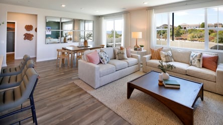 A living room with a wood floor.