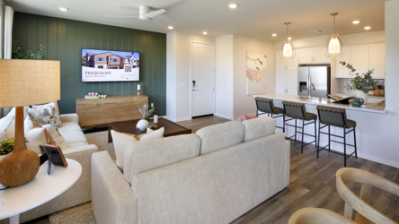 A living room with a couch and chairs.