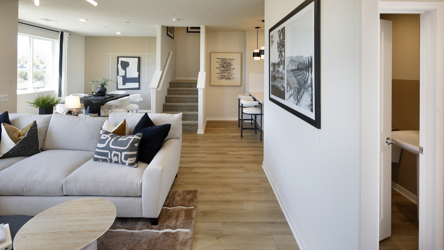 A living room with a couch and a table.