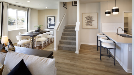 A large living room with a wood floor and a wood floor.